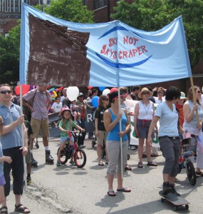 Hyde Park residents marching for responsible development on 53rd Street during the Hyde Park Neighborhood Parade, July 4th, 2013.